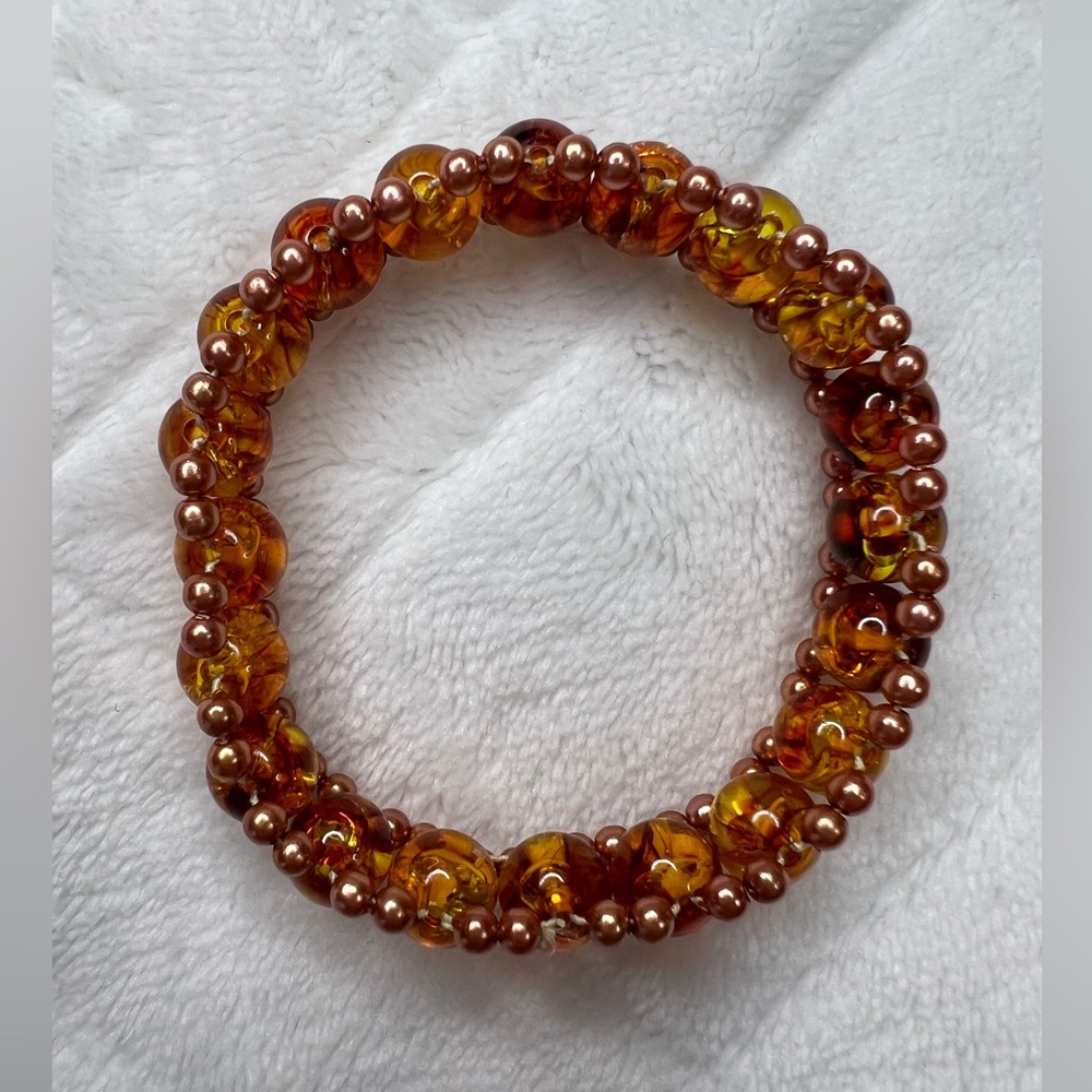 HAND STRUNG BROWN AND RUST BEADED BRACELET NWOT